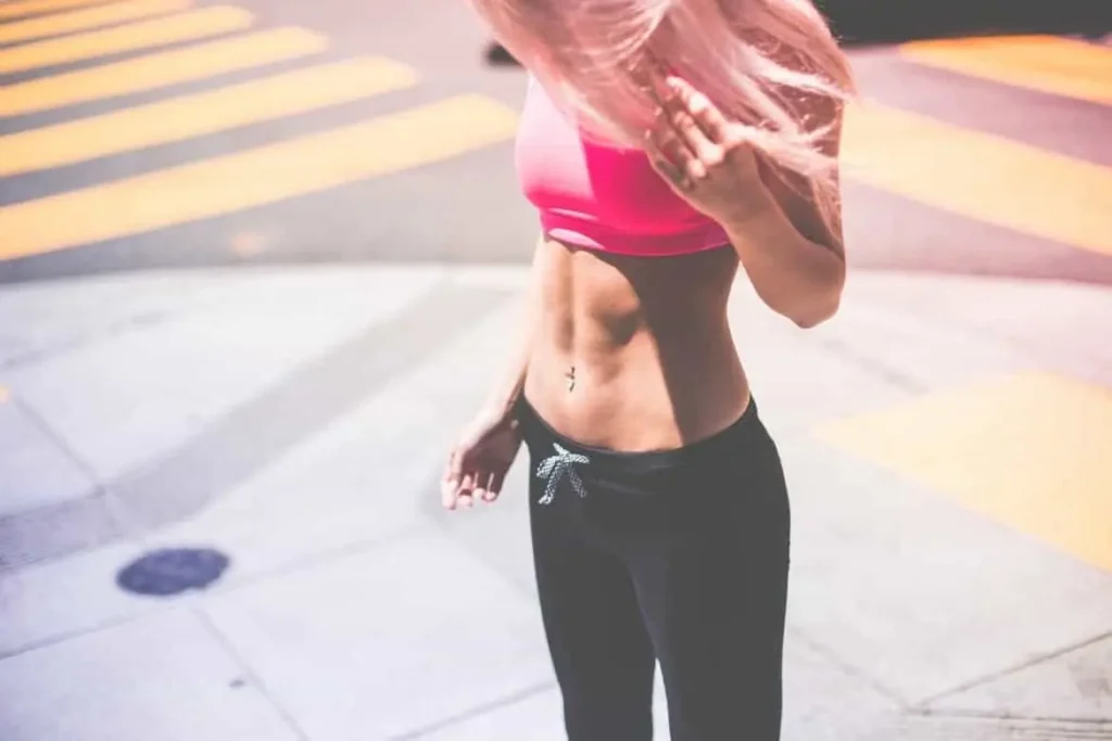 Woman with toned stomach after LA-EMS Body Sculpting Treatment Leyton